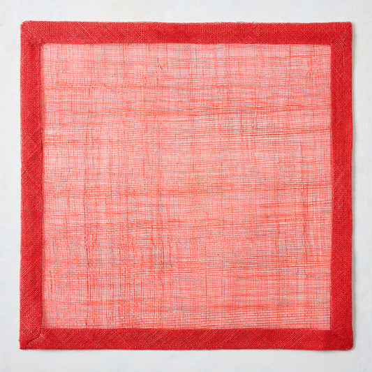 16-inch square red abaca fiber placemat with a semi-transparent woven center and a solid red fabric border.