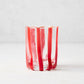 Hand-made Italian glass double old fashioned with vertical red stripes.
