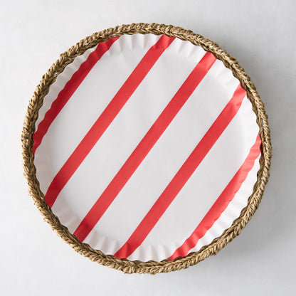Round red striped parchment liner in a woven basket.