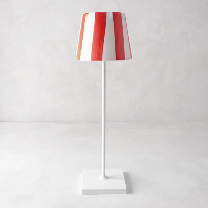 Red and white striped ceramic lamp shade on a white Poldina Pro lamp.