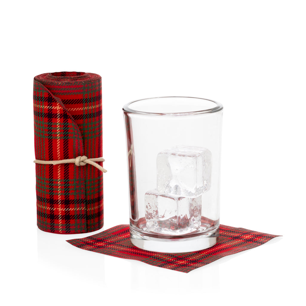 Roll of 50 red tartan tear-off cotton cocktail napkins with a glass of ice on one napkin.