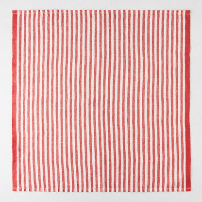 Red ticking stripe linen napkin, 21" square, with thin red and white stripes and a thicker red border.