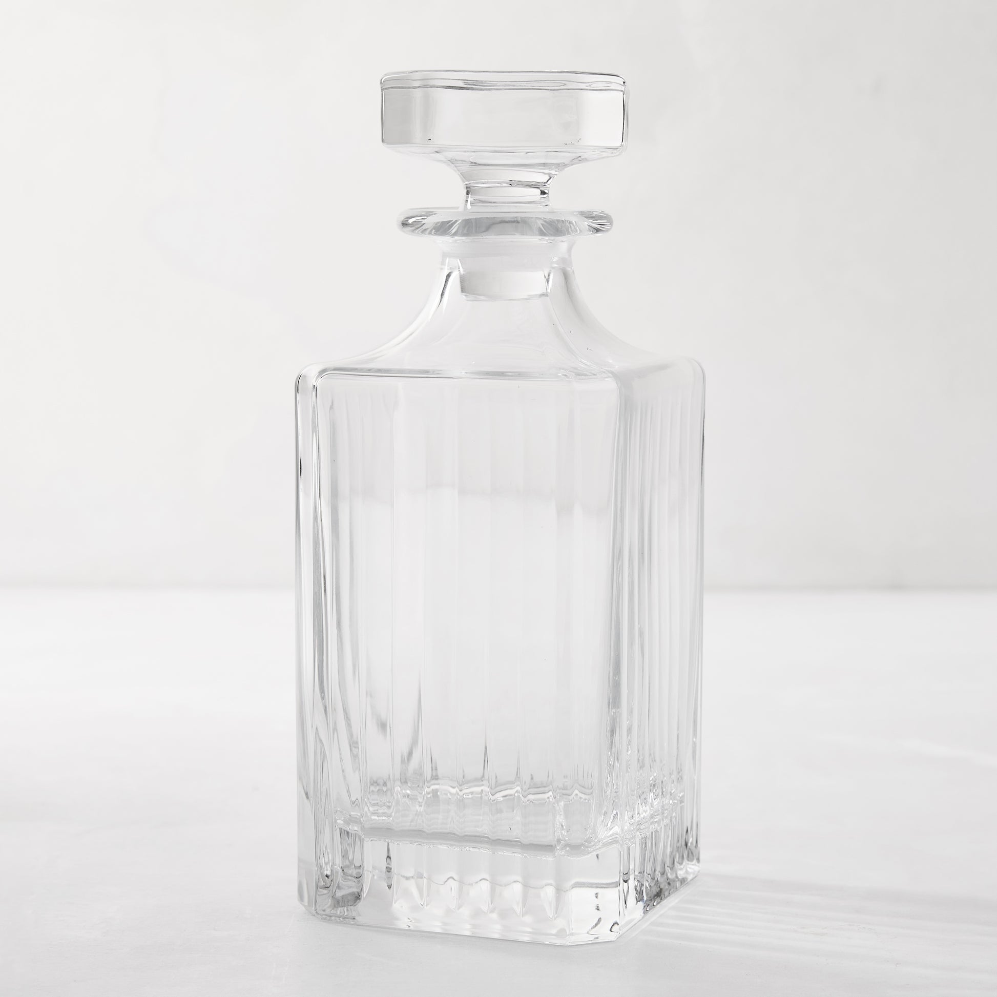 Regent Eco-Crystal Decanter, clear lead-free crystal with vertical ribbed design and square stopper.