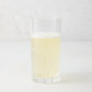 Regent Eco-Crystal High Ball Glass, clear, sleek, slender, with a bubbly light yellow drink.