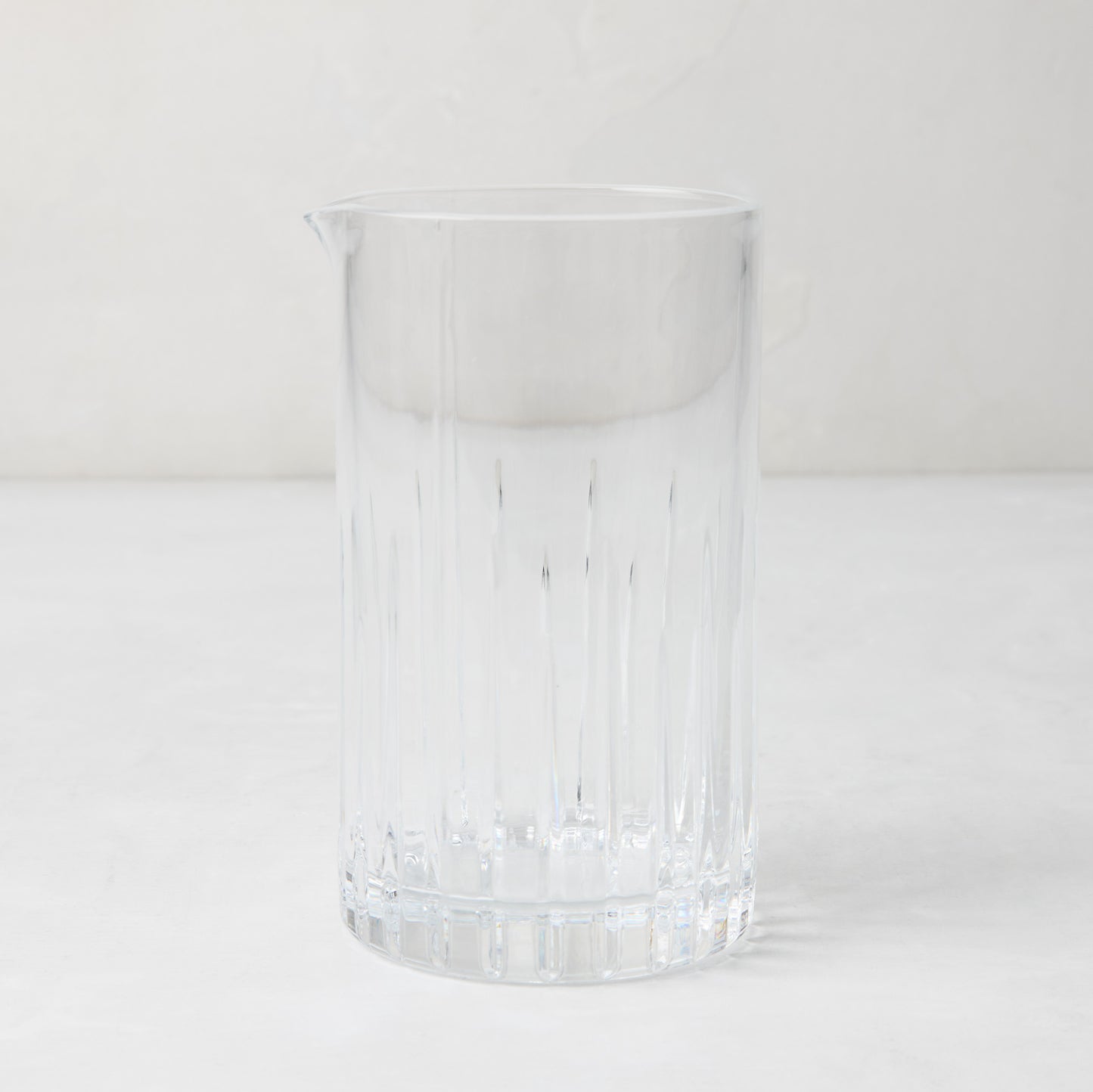 Regent Eco-Crystal Mixing Glass, clear lead-free crystal with vertical ribbed design and pour spout.