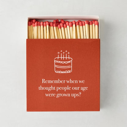 Oversized "Remember When" matches in a red box with a white birthday cake illustration and text.