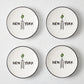 Set of four white appetizer plates with black rims, featuring a hand-painted Empire State Building, olive, and New York text.