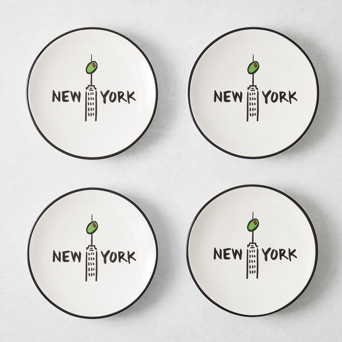 Set of four white appetizer plates with black rims, featuring a hand-painted Empire State Building, olive, and New York text.