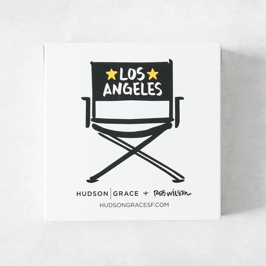 White box of Rob Wilson + Hudson Grace oversized matches featuring a black director's chair illustration and Los Angeles text.