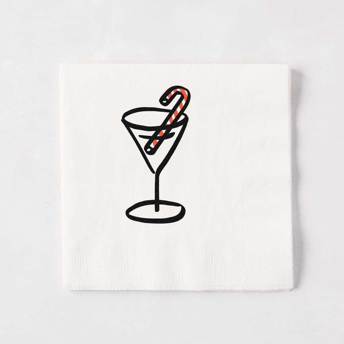 White 5.5-inch 3-ply paper cocktail napkin with a black line-drawn martini glass and red-striped candy cane illustration.
