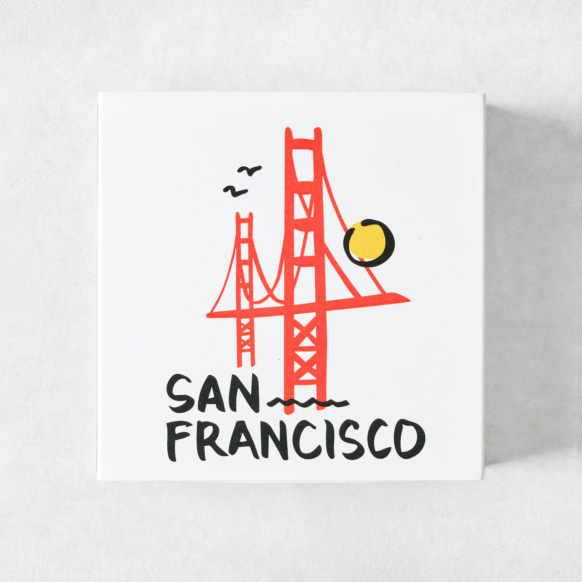 Square box of oversized matches featuring a red Golden Gate Bridge illustration and San Francisco text on white.