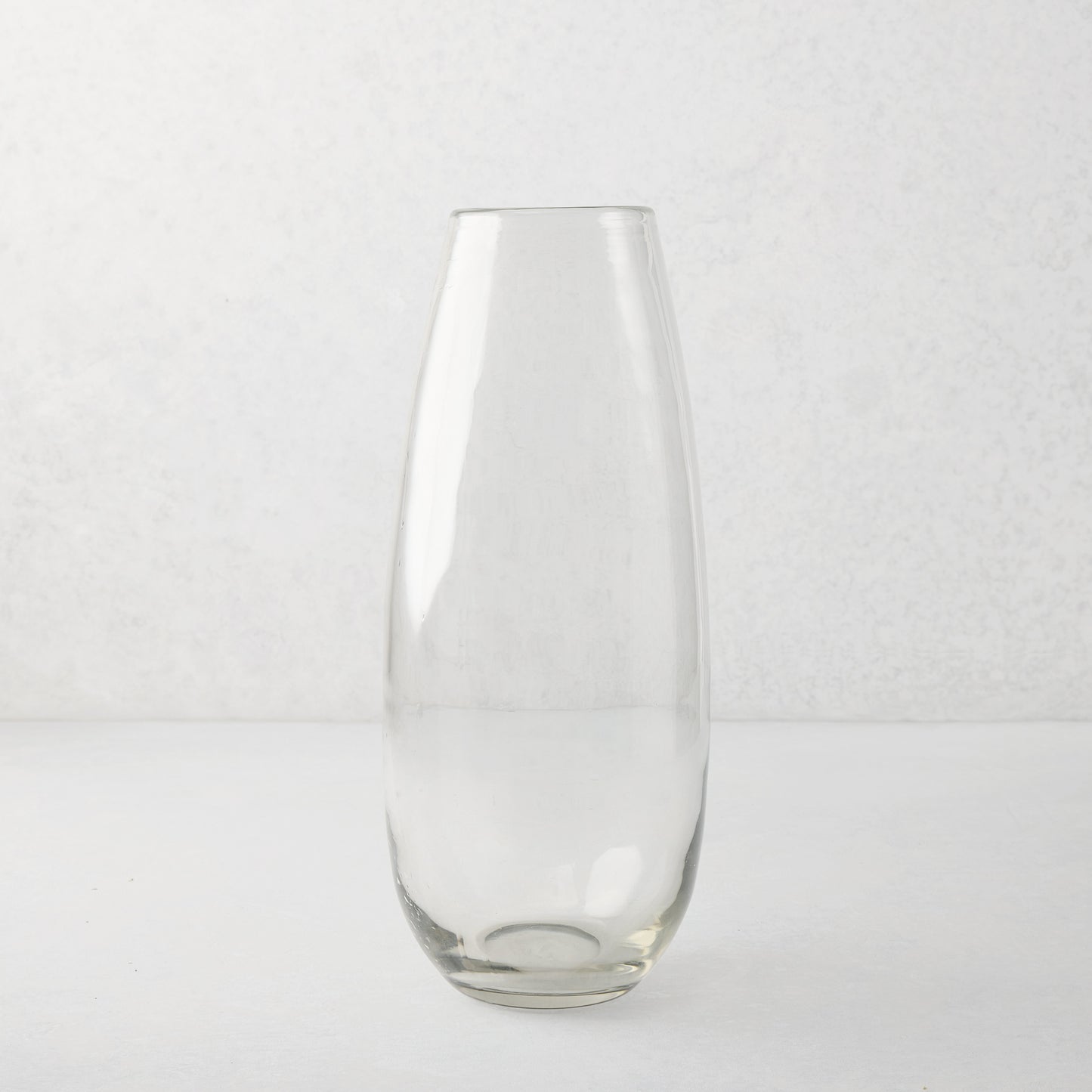Clear, tall, slender mouth-blown Robert Glass Vase, 14.6"H, with a subtle architectural presence.
