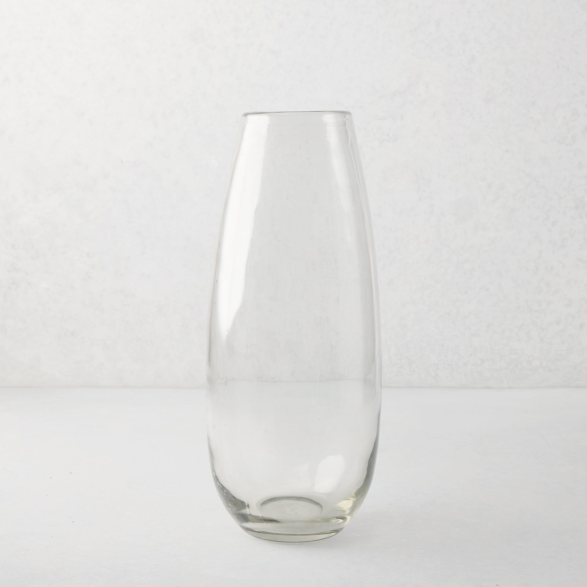 Clear, tall, slender mouth-blown Robert Glass Vase, 14.6"H, with a subtle architectural presence.
