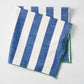 Rockport blue and white striped cotton napkin with green trim, folded.