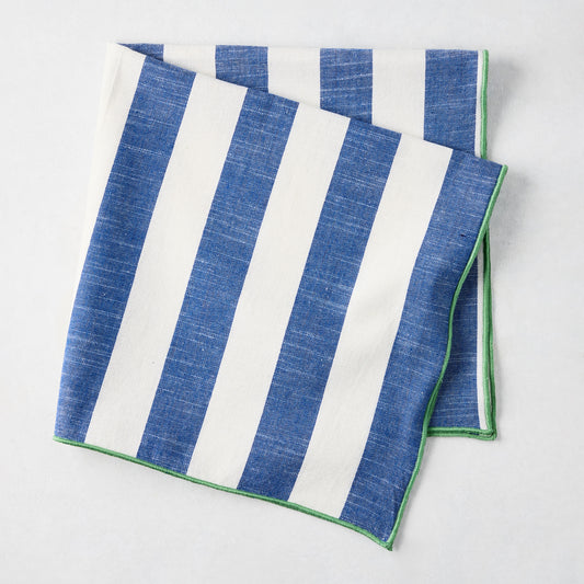 Rockport blue and white striped cotton napkin with green trim, folded.