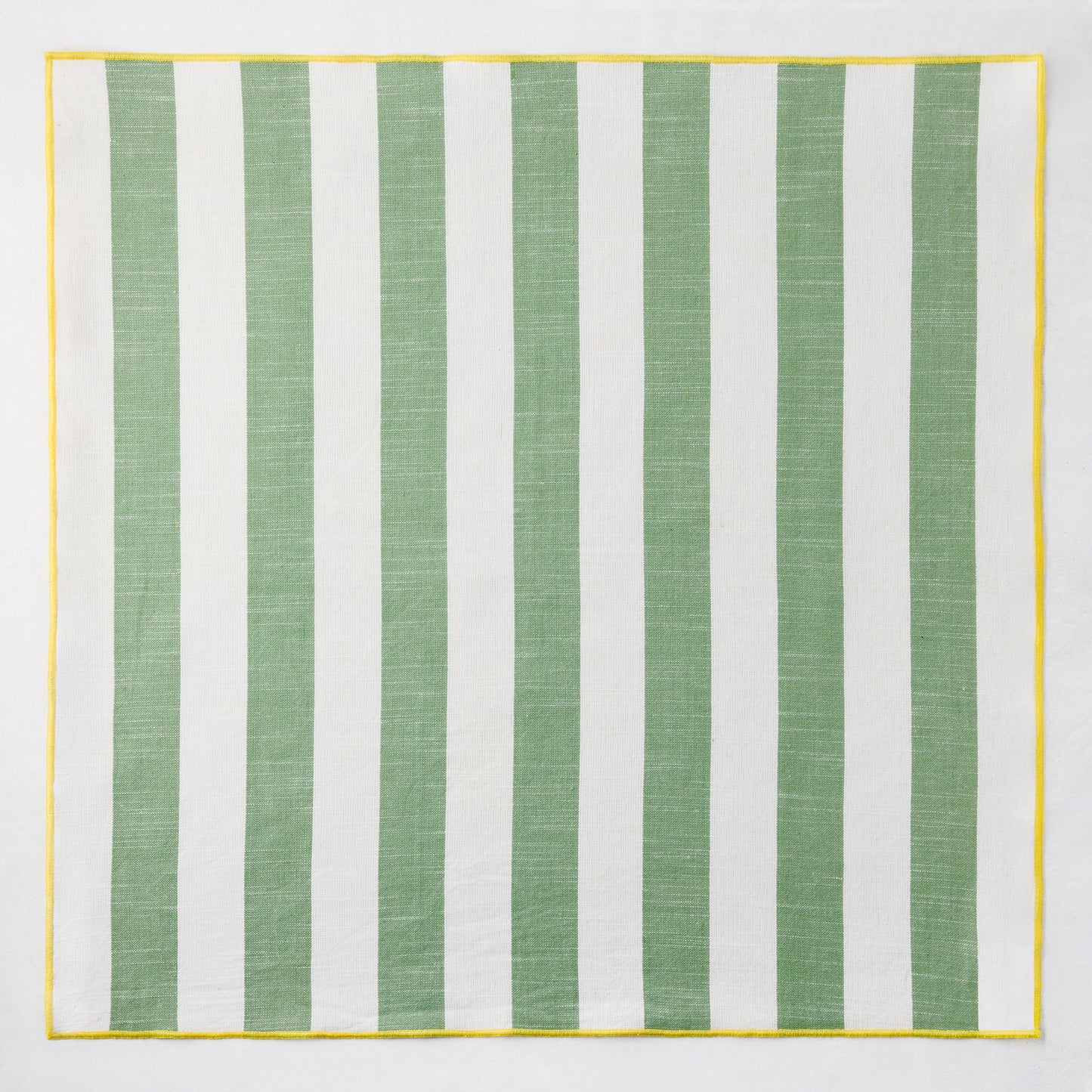 Rockport green and white striped cotton napkin with yellow trim, 22" square.