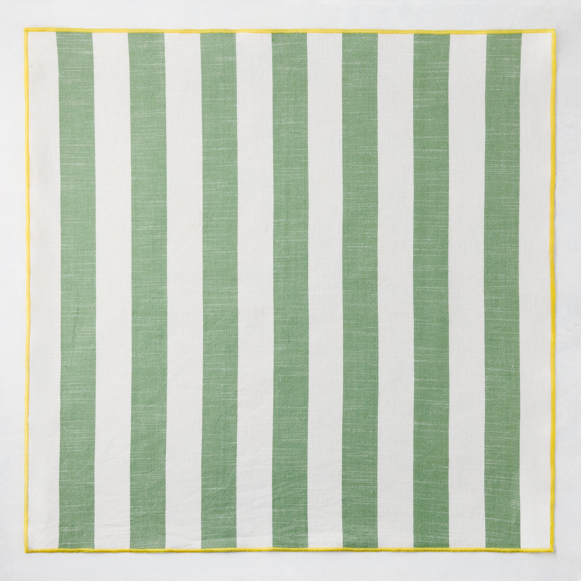 Rockport green and white striped cotton napkin with yellow trim, 22" square.