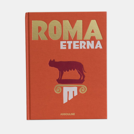 Orange hardcover "Roma Eterna" book with gold title, red Capitoline Wolf, and white column design.