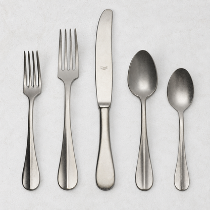 Roma Vintage 5-piece stainless steel flatware set with a matte finish, featuring a neo-baroque design on a white background.