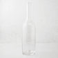 Clear mouth-blown glass Romeo wine carafe with a tall neck and scissor-cut rim.