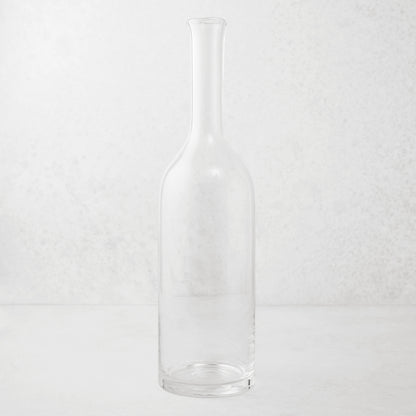 Clear mouth-blown glass Romeo wine carafe with a tall neck and scissor-cut rim.
