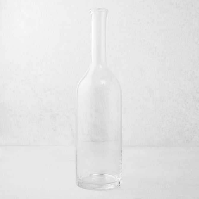 Clear mouth-blown glass Romeo wine carafe with a tall neck and scissor-cut rim.