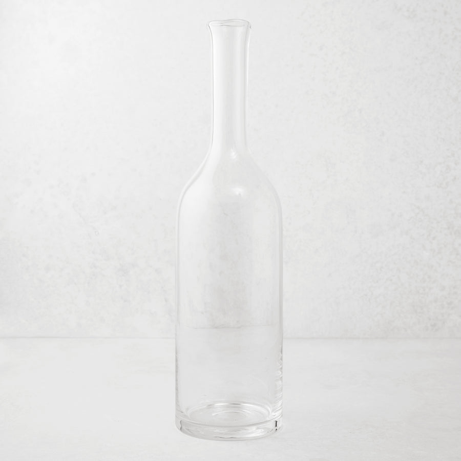 Clear mouth-blown glass Romeo wine carafe with a tall neck and scissor-cut rim.