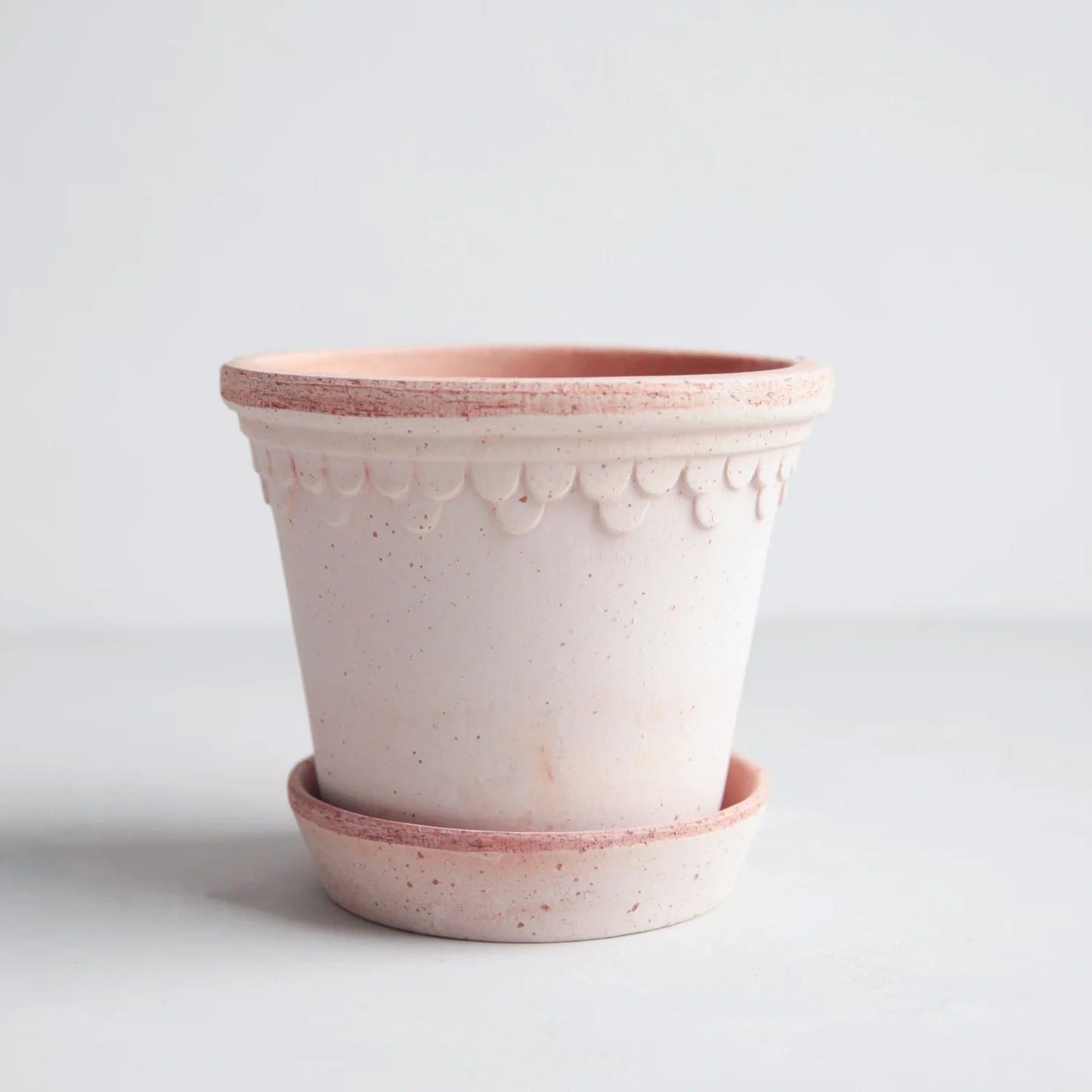Rosa Mediuma terracotta pot and saucer, 8.3" x 7.3", with delicate scalloped detailing.