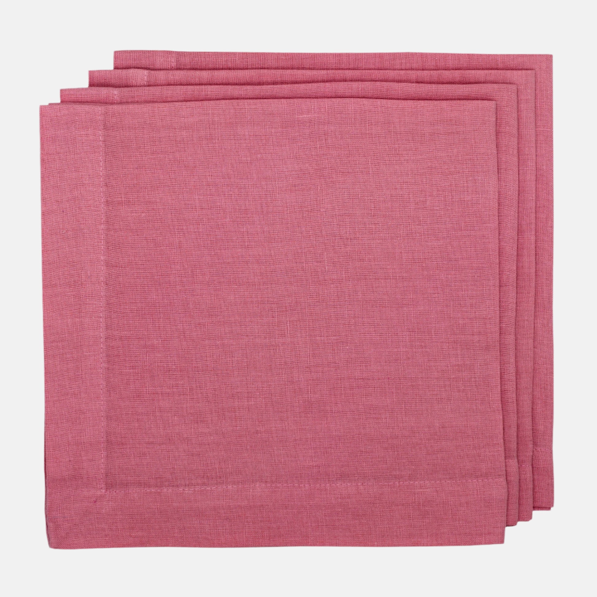 Stack of three Rosy HG hand-dyed 22" square linen napkins with mitered corners.