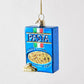 Blue glass rotini pasta box Christmas ornament with gold glitter accents and Italian flag detail.