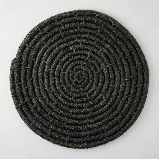 Round black woven abaca placemat, 15" Dia, with concentric spiral design.