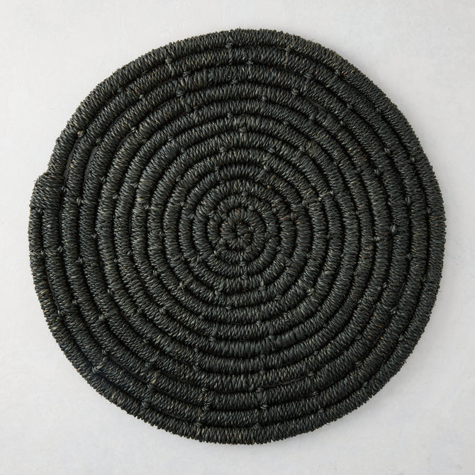 Round black woven abaca placemat, 15" Dia, with concentric spiral design.
