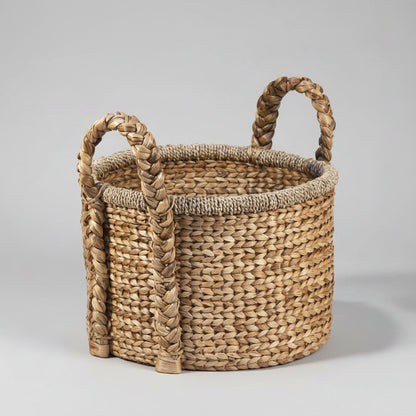 Round woven water hyacinth basket with braided handles.