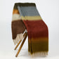 Handwoven Mantas Ezcaray Matisse mohair throw in rust, green, blue, and brown stripes with fringe, 79x51 inches.