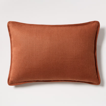 Rust orange tonal reversible velvet and linen lumbar pillow, 20x14 inches.
