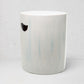 Rustic white ceramic cylinder garden stool with subtle blue streaks and a handle cutout.