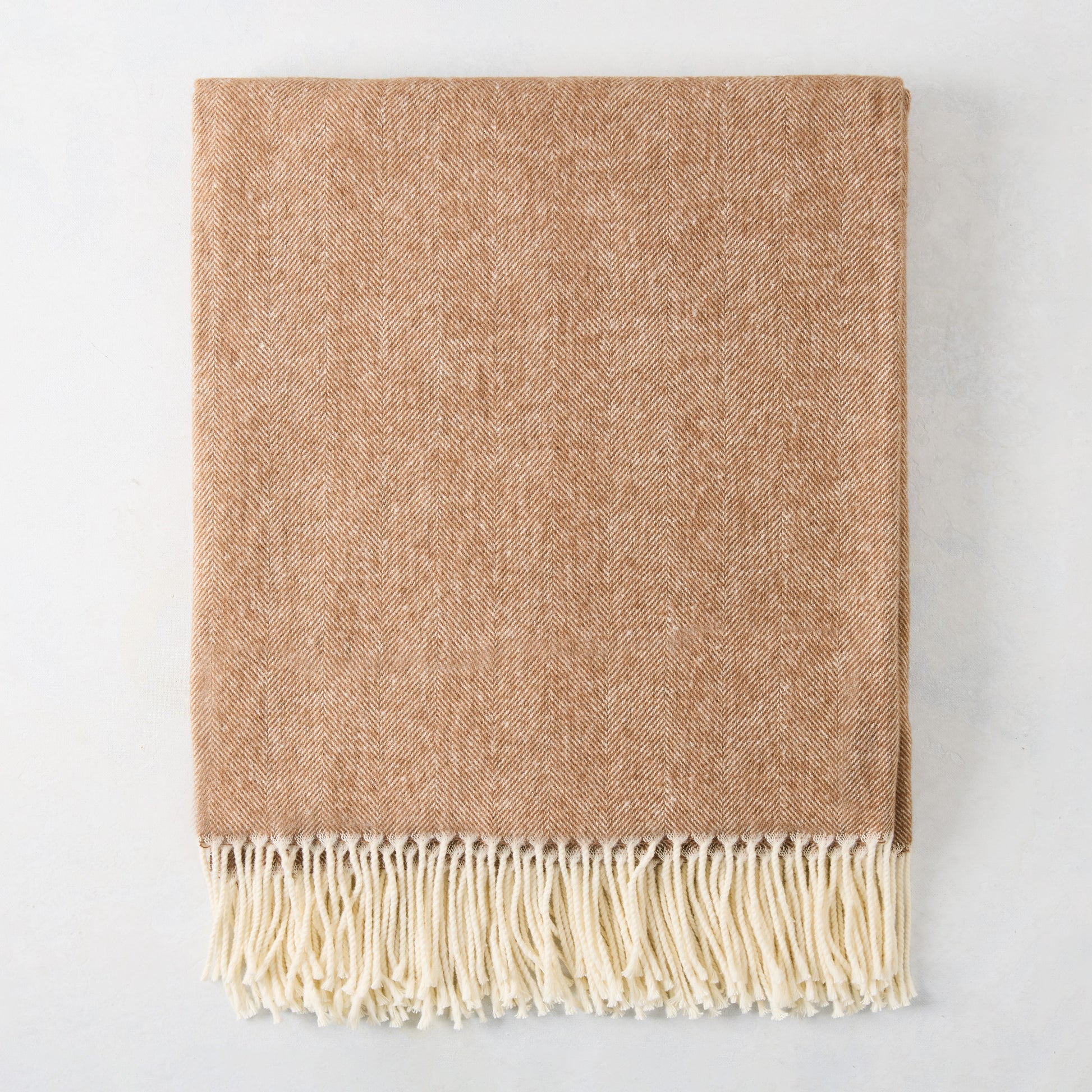 Saddle brown Italian herringbone throw blanket with decorative cream fringe, 51"W x 67"L.