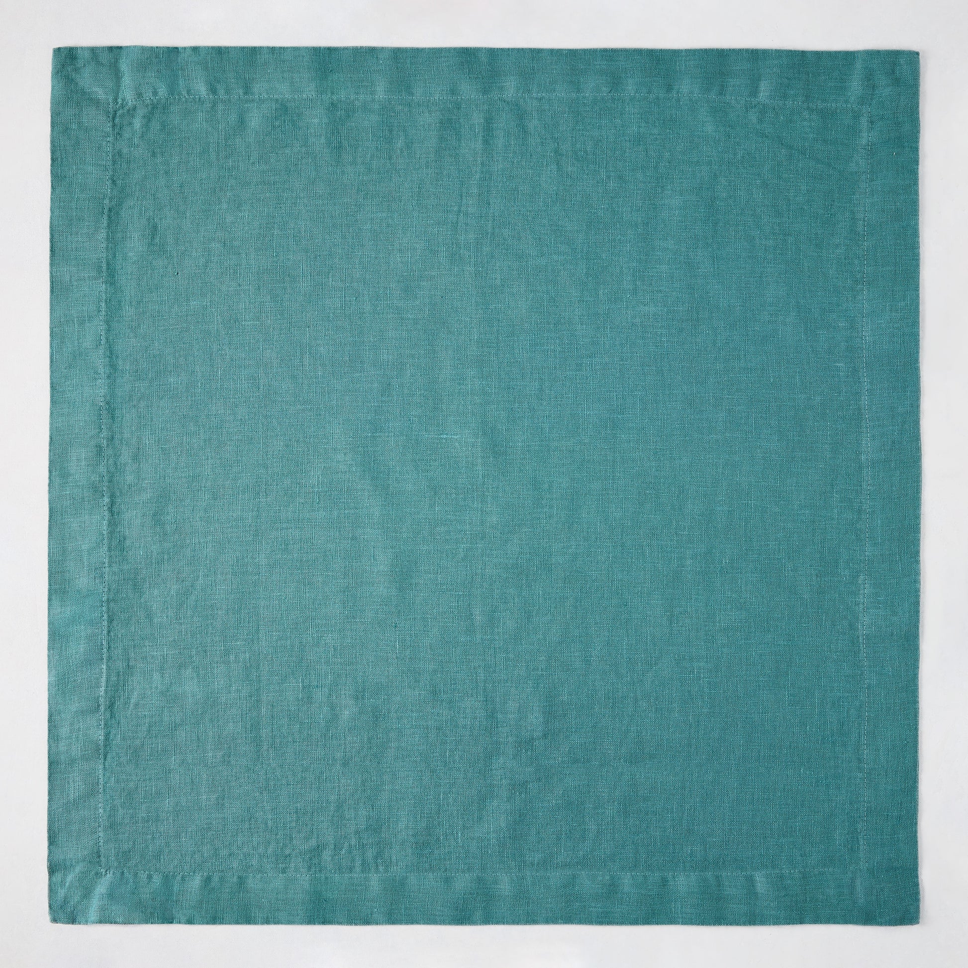 Sage HG Signature hand-dyed linen napkin, 22-inch square, earthy teal with mitered corners.