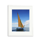 Sailing in Mauritius framed wall art print with a vibrantly striped sailboat on clear waters.