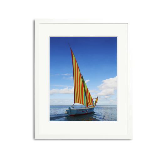Sailing in Mauritius framed wall art print with a vibrantly striped sailboat on clear waters.