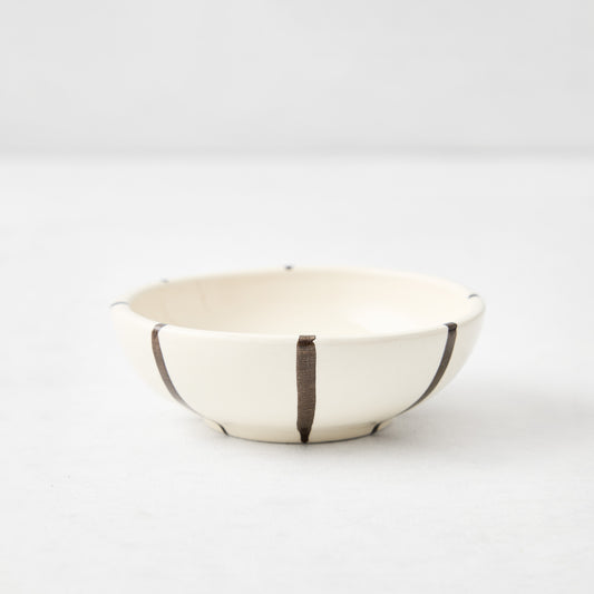 Salerno ceramic dipping bowl in cream with hand-painted chocolate brown vertical stripes, 3.5-inch diameter.