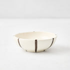 Salerno ceramic dipping bowl in cream with hand-painted chocolate brown vertical stripes, 3.5-inch diameter.