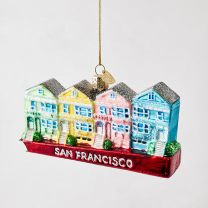 Hand-painted glass and resin San Francisco Painted Ladies ornament featuring colorful row houses with glitter accents.