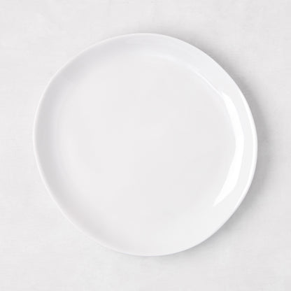 Sandia White 7.75" melamine salad plate with organic, hand-thrown-inspired curves.
