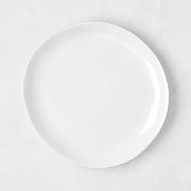 Sandia White 7.75" melamine salad plate with organic, hand-thrown-inspired curves.