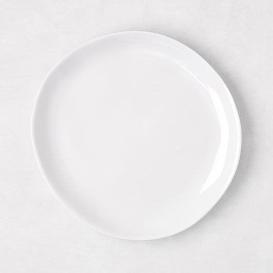 Sandia White 7.75" melamine salad plate with organic, hand-thrown-inspired curves.