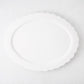White ceramic Scallop Oval Serving Platter, 17.72"L x 14.17"W, with a subtle scalloped edge.