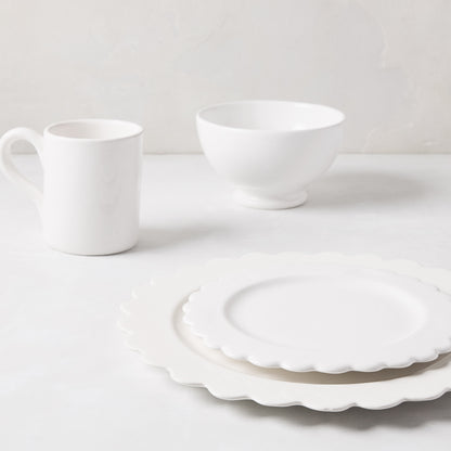 White ceramic scalloped salad plate, 8.75" diameter, stacked on a larger plate with a mug and bowl.