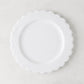 White ceramic scalloped salad plate, 8.75" diameter, on a light background.