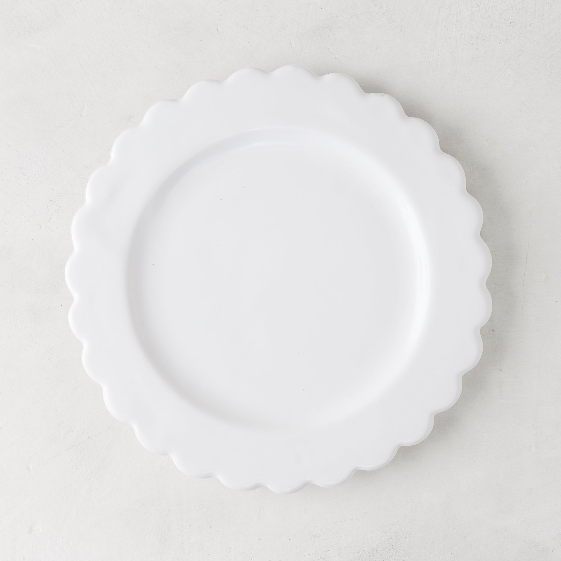 White ceramic scalloped salad plate, 8.75" diameter, on a light background.
